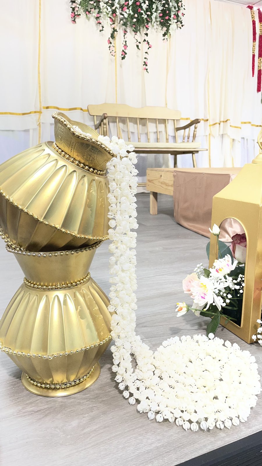 Brass kalash pots with jasmine garlands